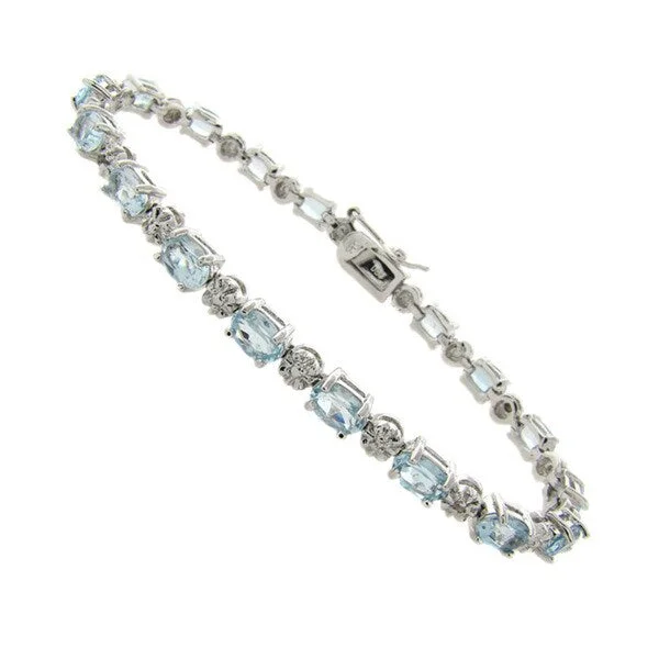 Dolce Giavonna Silver Blue Topaz and Diamond Accent Bracelet