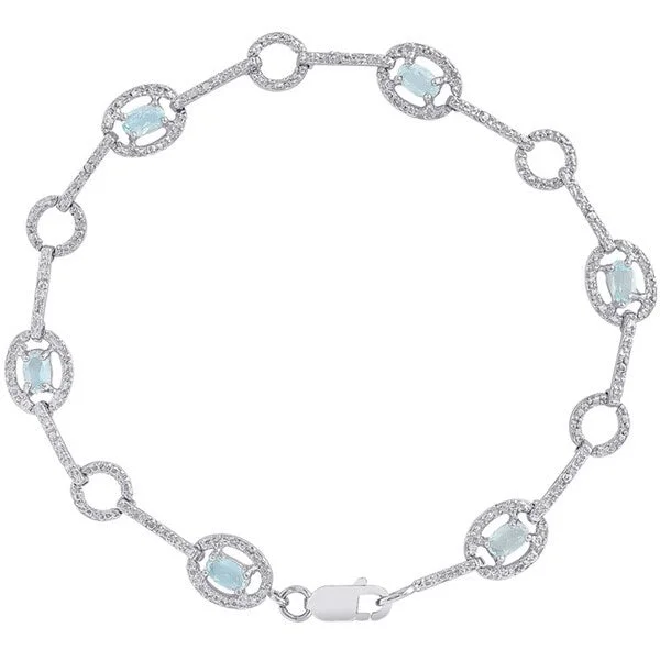 Dolce Giavonna Sterling Silver Blue Topaz and Diamond Accent Circle Design Bracelet